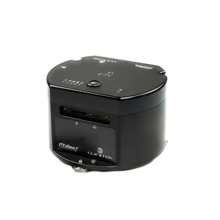 TRITON-F high-performance triaxial accelerograph with integrated FBA sensors, a removable SD card, and a SIM slot for urban structural health monitoring.