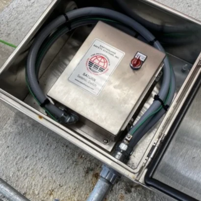 SATURN seismic switch installed in a stainless steel outdoor enclosure with liquid-tight conduit and relay wiring