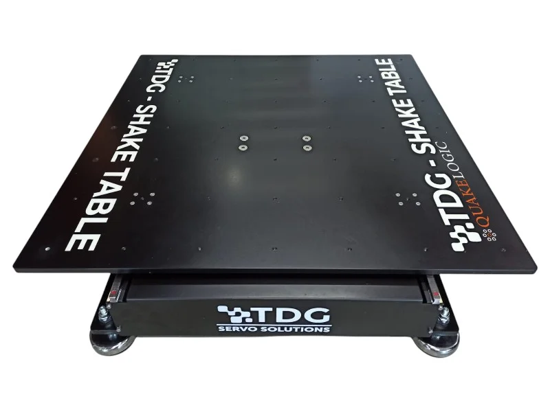 QuakeLogic 250-kg capacity servo-electro-mechanical shake table featuring a 1000mm by 1000mm platform for uniaxial or biaxial seismic testing.