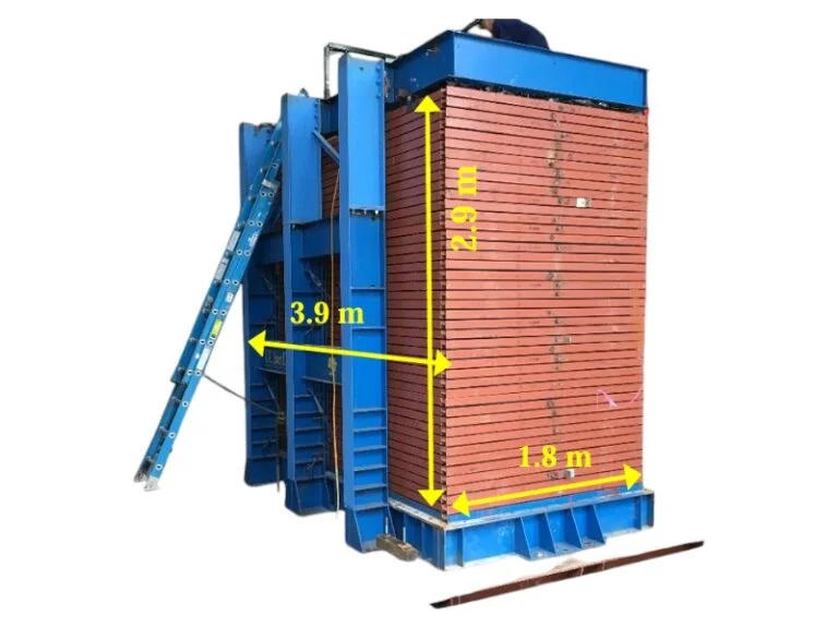A layered laminar soil box with integrated pore pressure ports and ±5 mm linear motion capabilities, used for simulating real-world seismic events and dynamic soil behavior analysis.